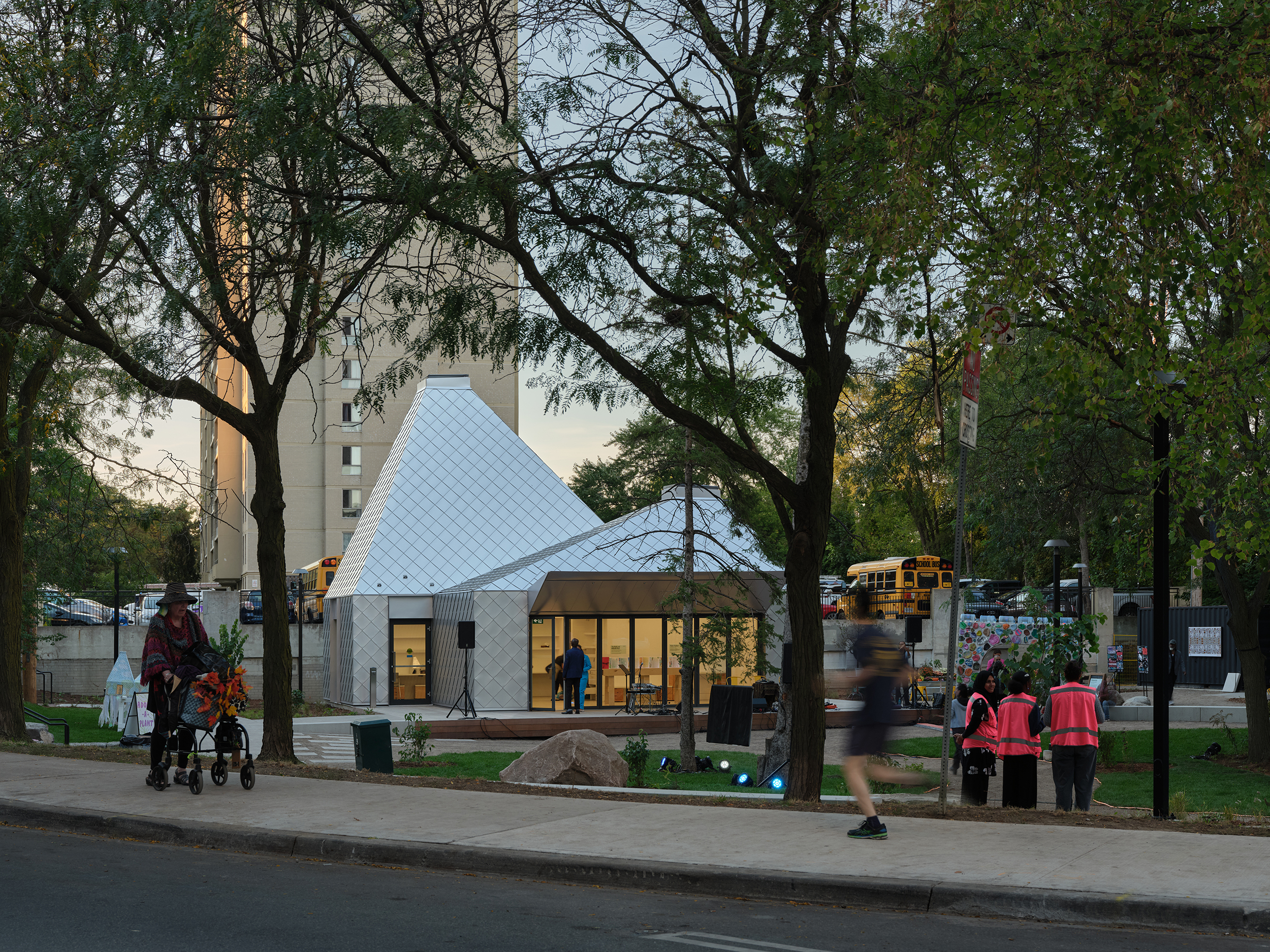 View of Mabelle Park, with "The Belle" pavilion in the back and the greenspace in the foreground. Image by Doublespace Photography, courtesy of LGA Architectural Partners Ltd.