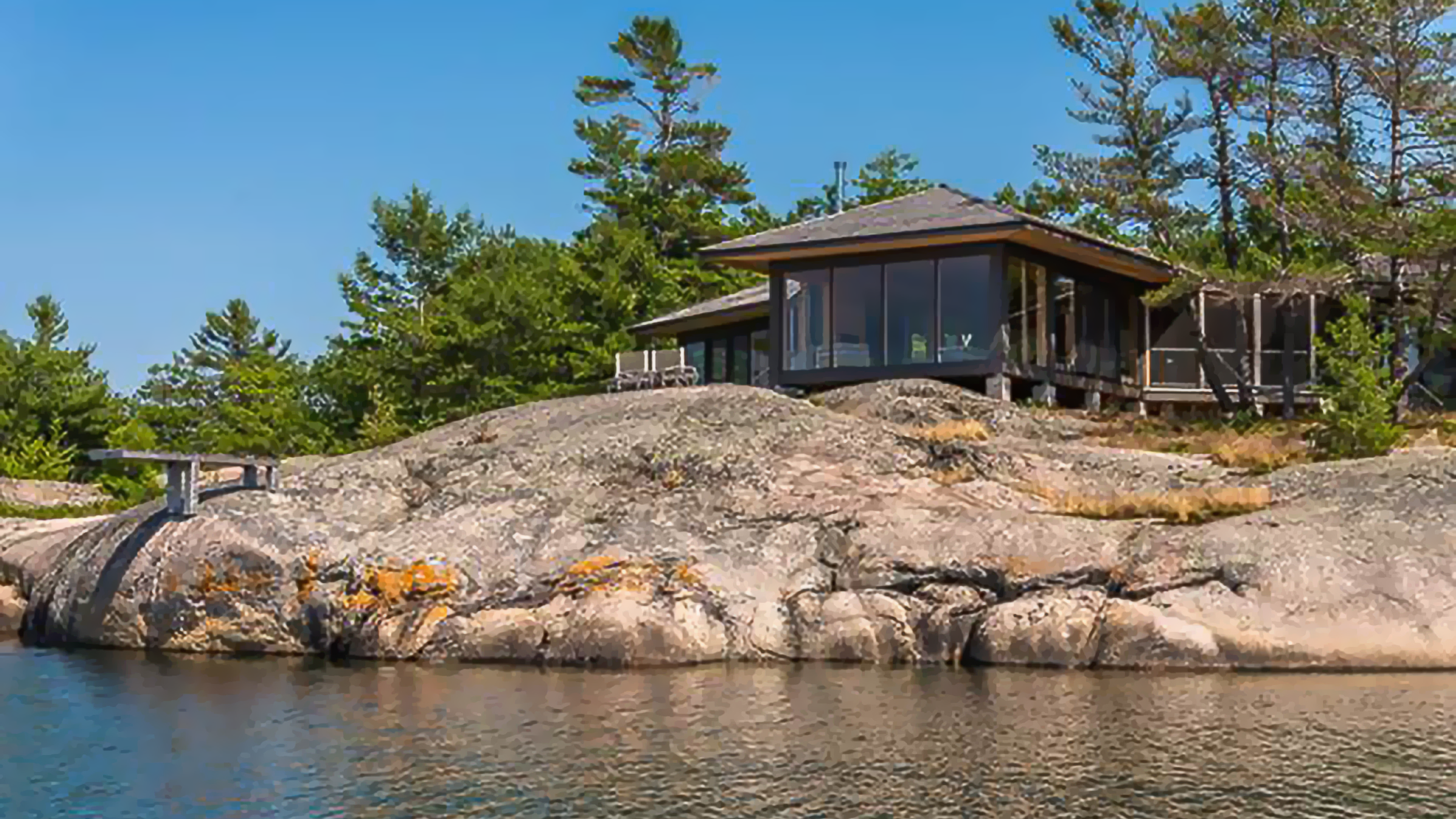 Exterior of Building on Cliff Beside Water